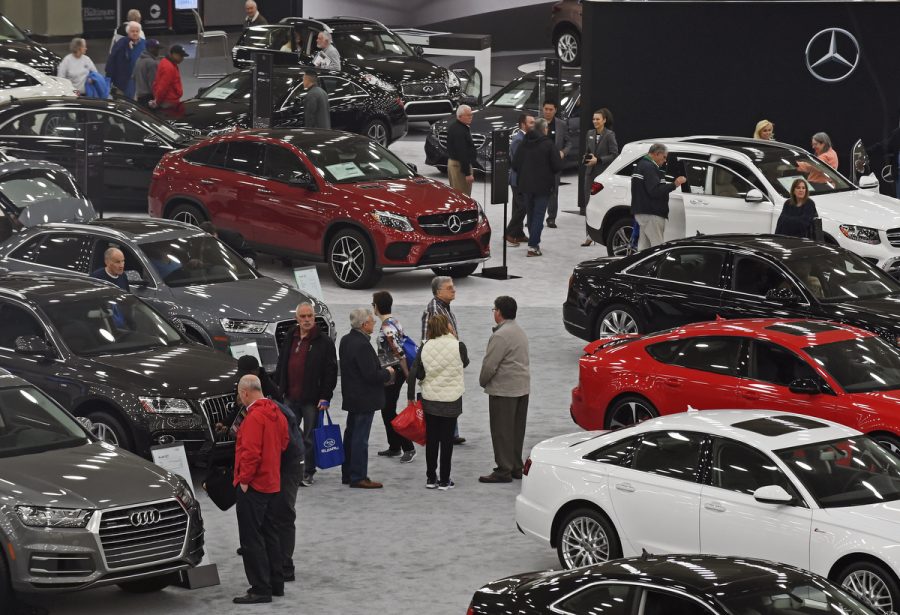 Show goers browse on opening day at the 2016 Motor Trend International Auto Show Baltimore at the Convention Center. (Kenneth K. Lam/Baltimore Sun)